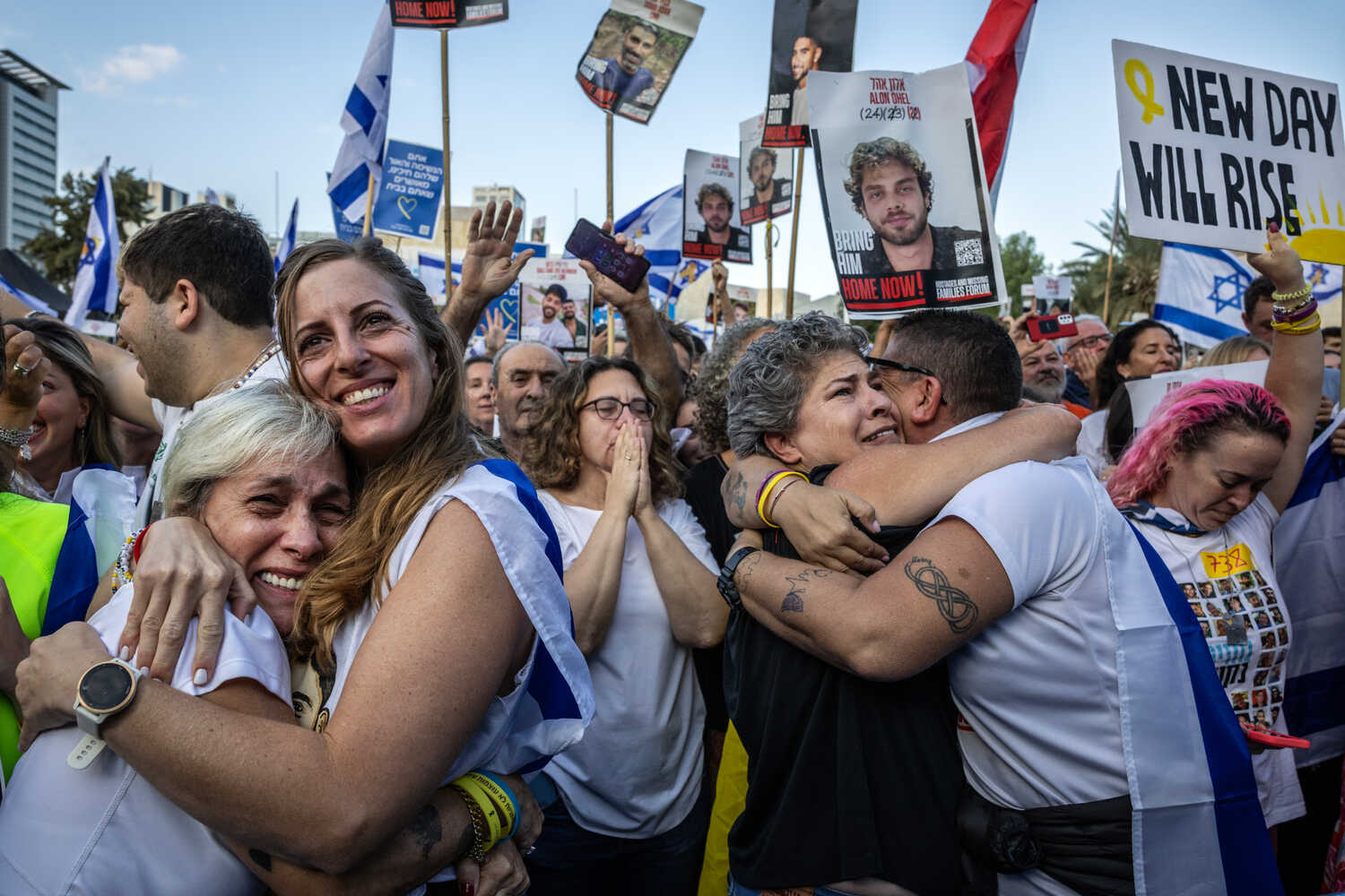 People embracing in Hostages Square.